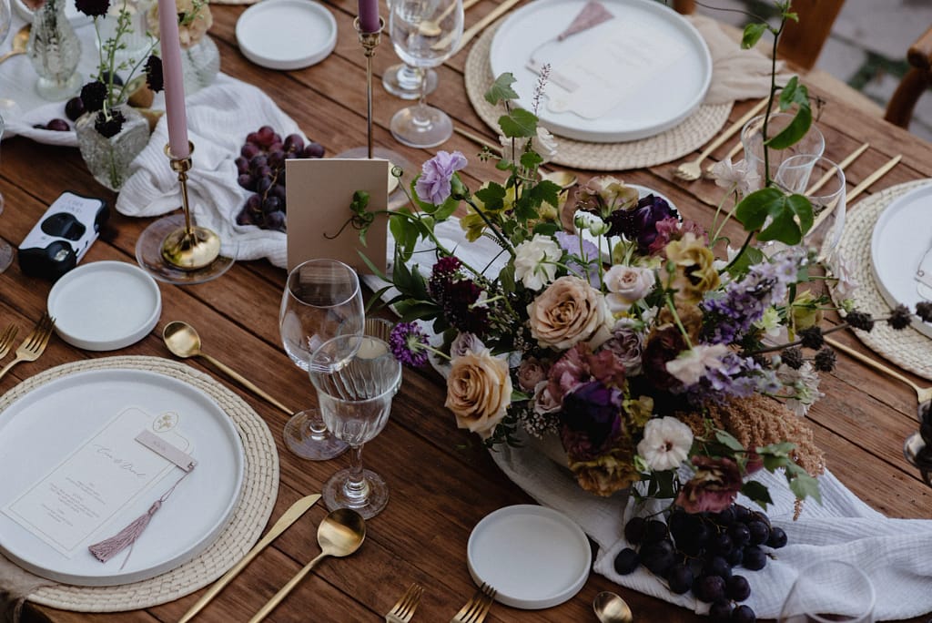 Romantic garden-style wedding flowers featuring mauve, blush, plum, and buttery yellow florals, Mexico Wedding