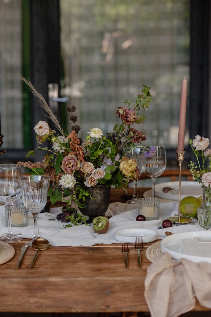 Romantic garden-style wedding flowers featuring mauve, blush, plum, and buttery yellow florals