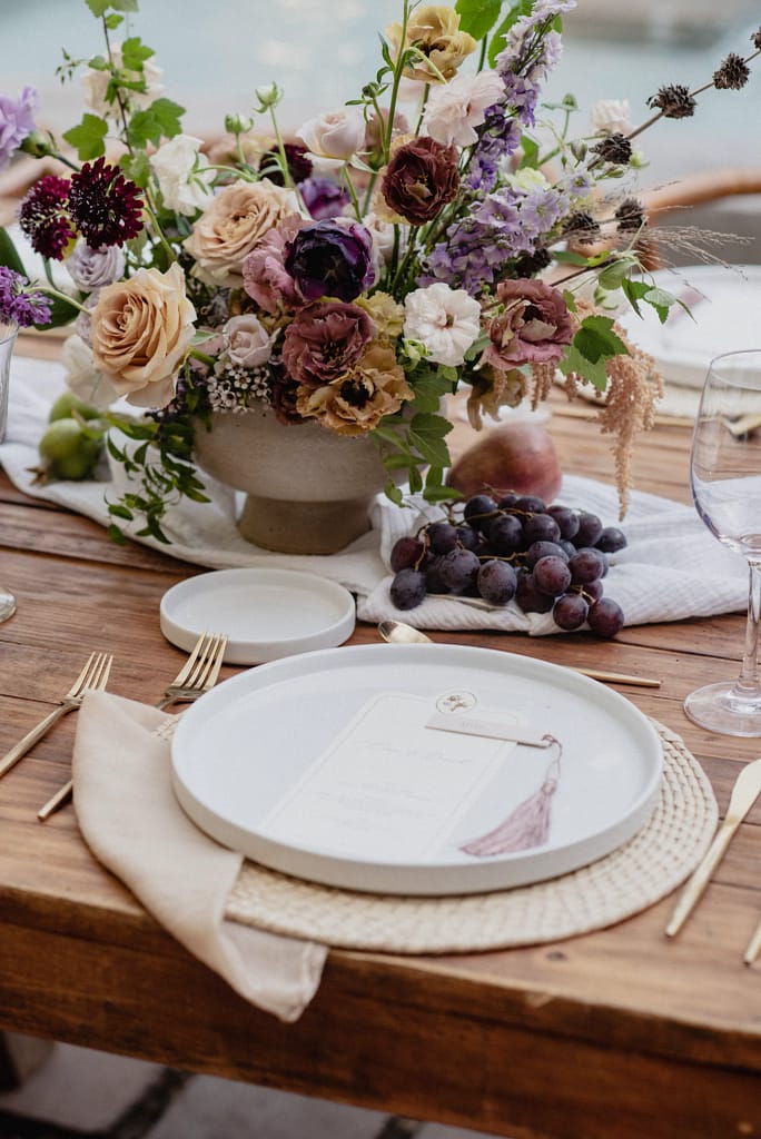 Romantic garden-style wedding flowers featuring mauve, blush, plum, and buttery yellow florals