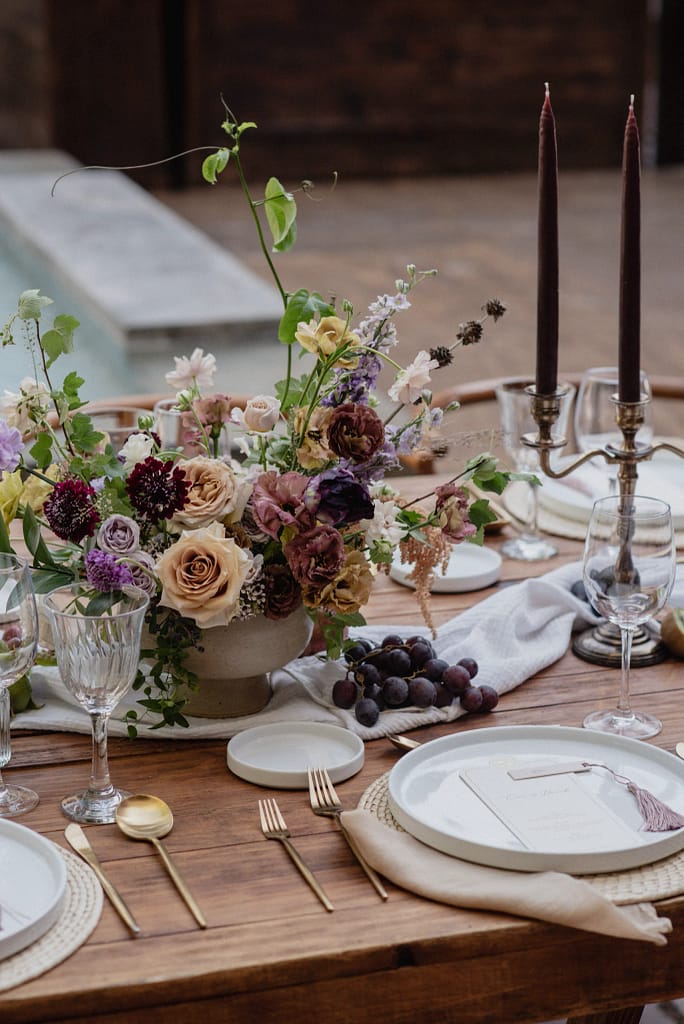 Romantic garden-style wedding flowers featuring mauve, blush, plum, and buttery yellow florals, Mexico Wedding