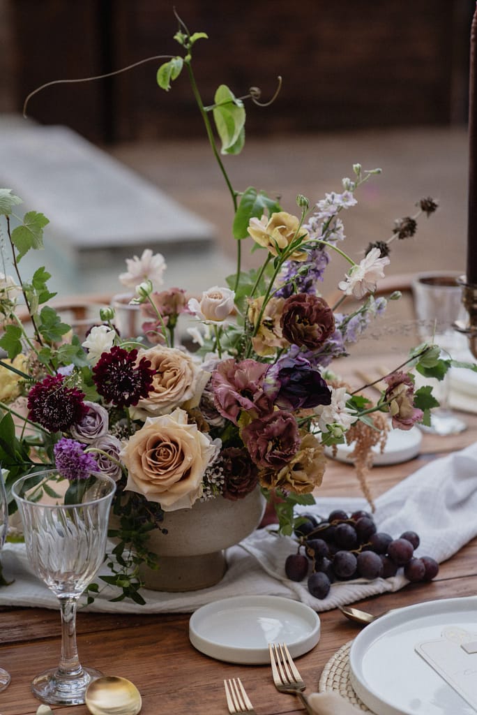 Romantic garden-style wedding flowers featuring mauve, blush, plum, and buttery yellow florals, Mexico Wedding