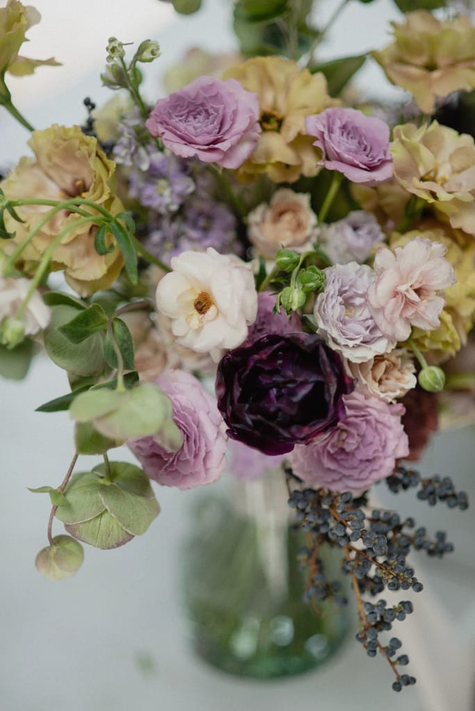 Romantic garden-style wedding flowers featuring mauve, blush, plum, and buttery yellow florals