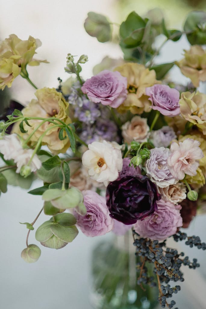 Romantic garden-style wedding flowers featuring mauve, blush, plum, and buttery yellow florals
